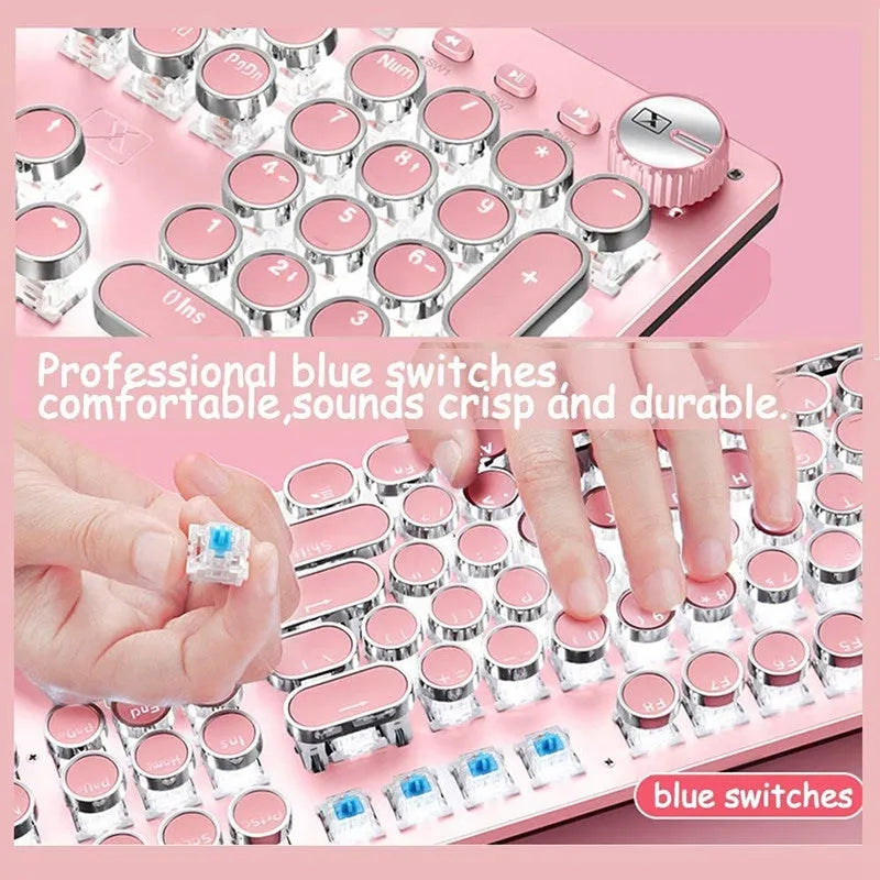 Silver and pink wired mechanical keyboard with green switches and matching ergonomic mouse.