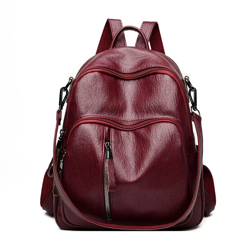 Stylish PU backpack in black, red, and blue colours with a sleek, square silhouette and multiple interior compartments