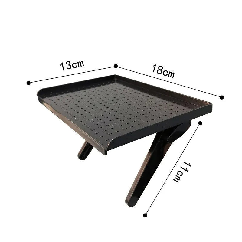 Plastic TV set-top box and router storage rack with hook-free installation on a desktop.
