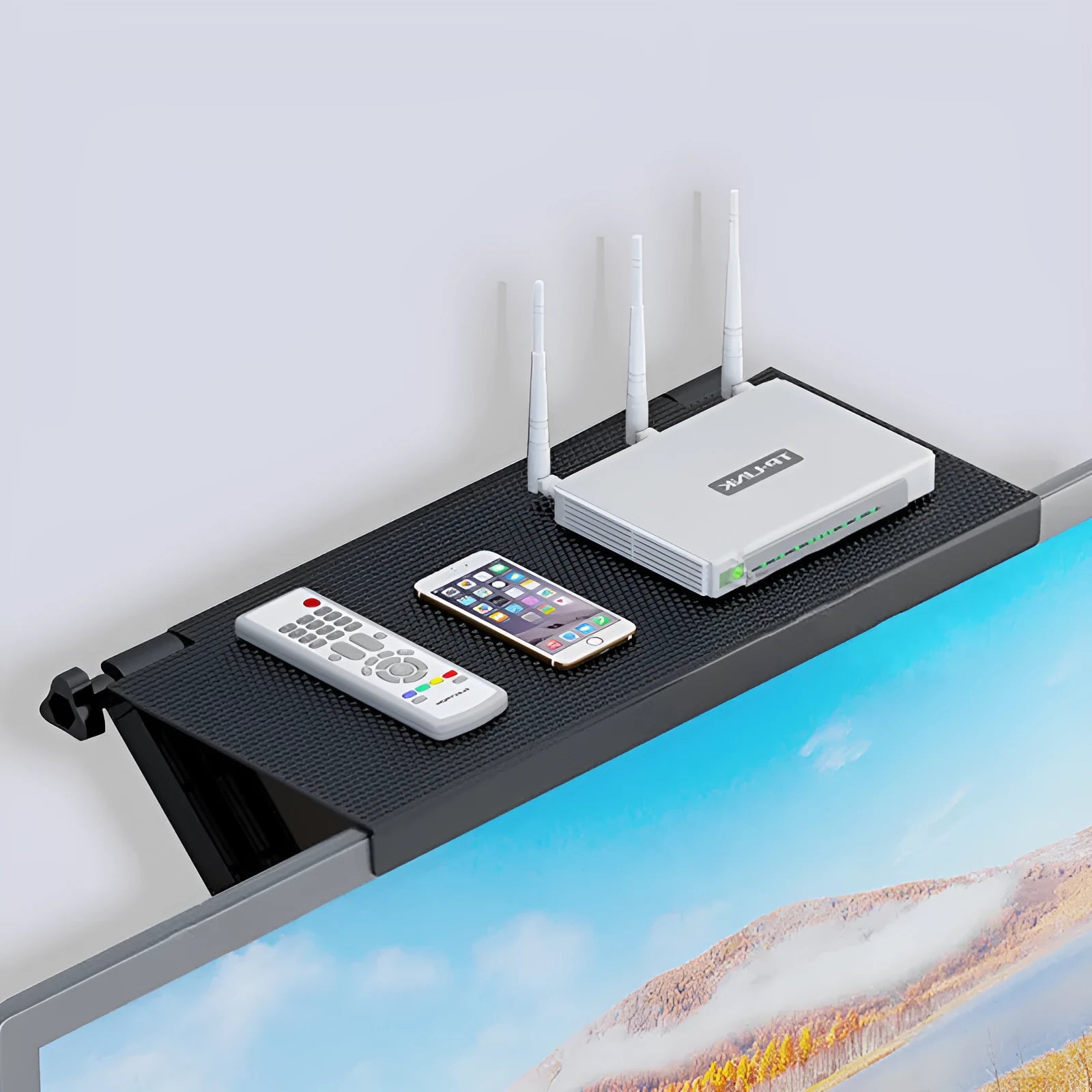 Plastic TV set-top box and router storage rack with hook-free installation on a desktop.