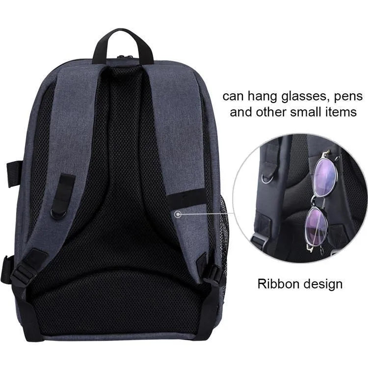 Black cotton outdoor photography mountaineering bag 20L with straps on a rocky hiking trail