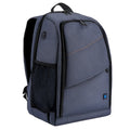 Black cotton outdoor photography mountaineering bag 20L with straps on a rocky hiking trail
