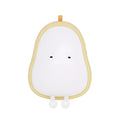 Soft white silicone pear-shaped night light with a warm yellow glow on a wooden surface.