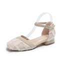 Women's apricot suede low-heel flats with an ankle strap in D'Orsay style on a white background.