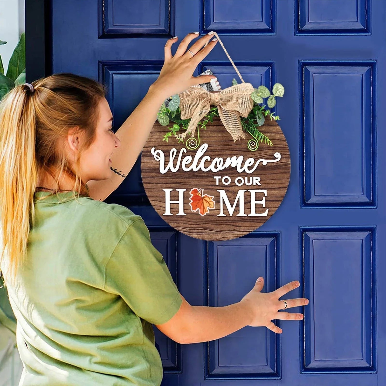 Rustic farmhouse-style seasonal welcome door hanger with interchangeable plaques for year-round decor