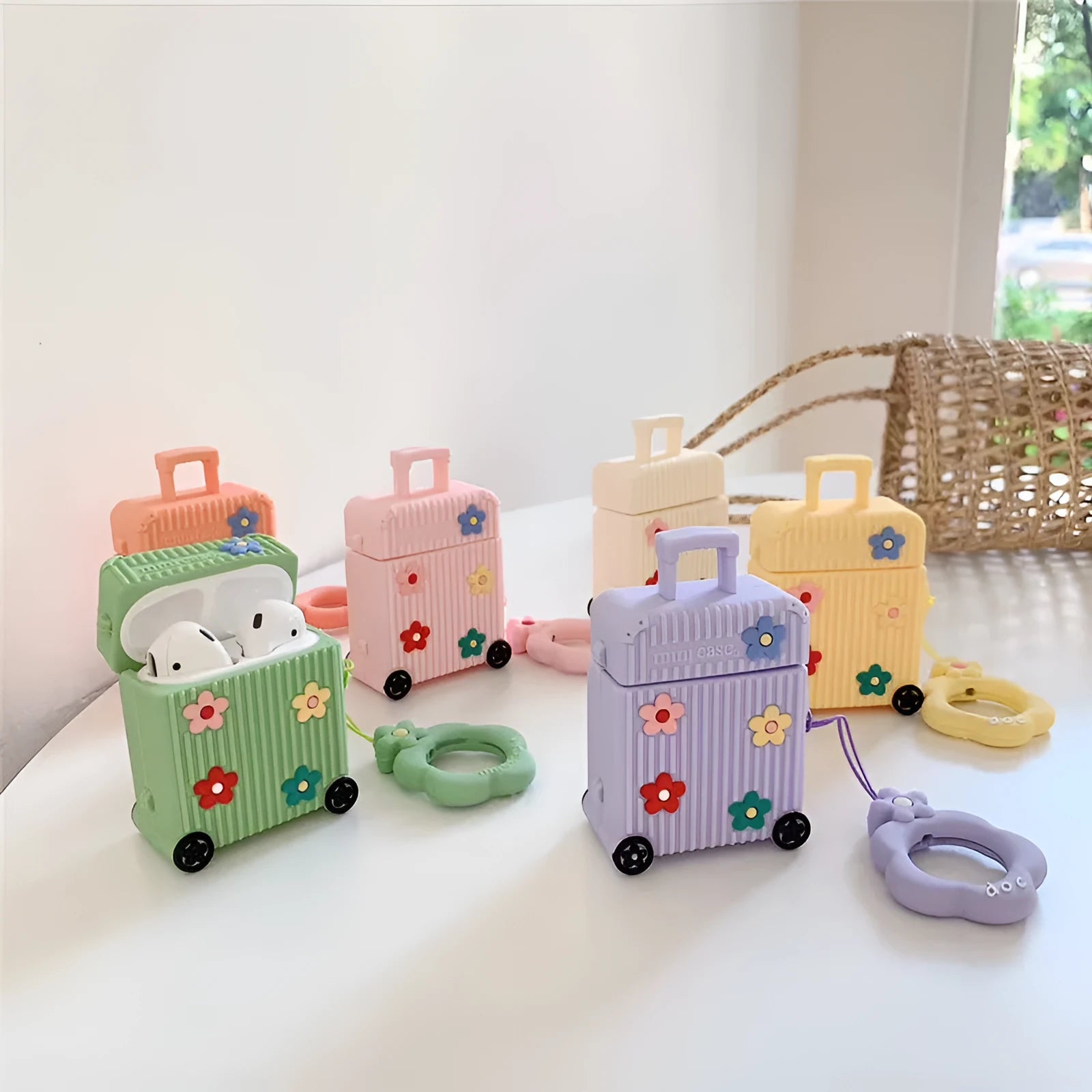 Silicone flip protective case for Apple AirPods in pink, purple, white, green, orange, and yellow colour options