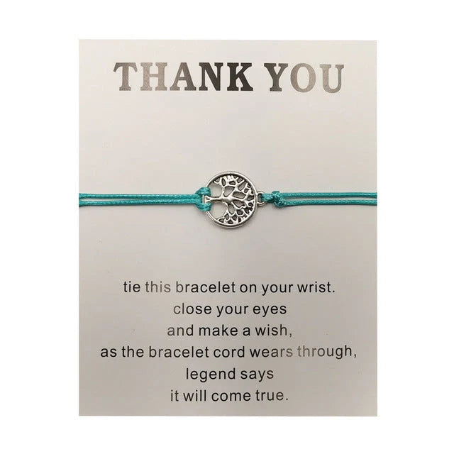 Hand-woven red rope Tree of Life bracelet with adjustable sizing