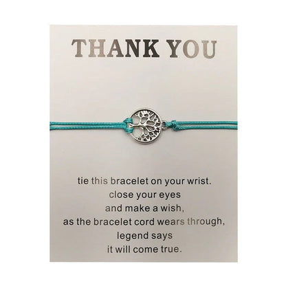 Hand-woven red rope Tree of Life bracelet with adjustable sizing