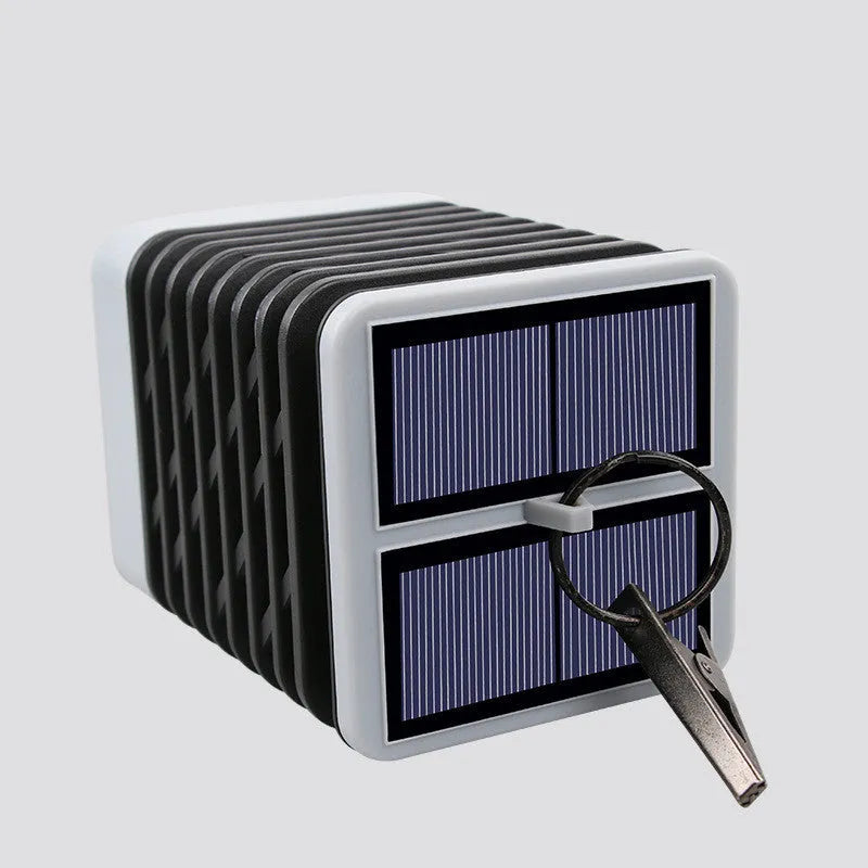 Solar candle flame lawn lamp with 75 yellow LEDs, IP55 rating, placed in a garden setting
