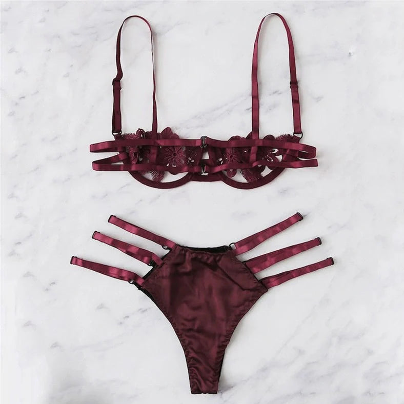 Women's black floral half-cup bra and brief set with fitted straps and back closure