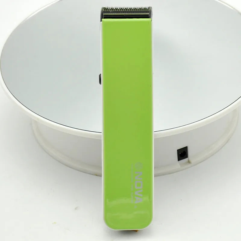 Electric hair clipper with removable blade head in five colour options: black, blue, orange, red, white.