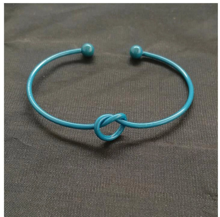 Knotted Knot O-Type Metal Openwork Bracelet in various colours, showcasing unique openwork design