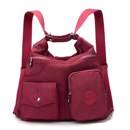 Women's waterproof nylon crossbody bag with organizational pockets and 34cm laptop capacity