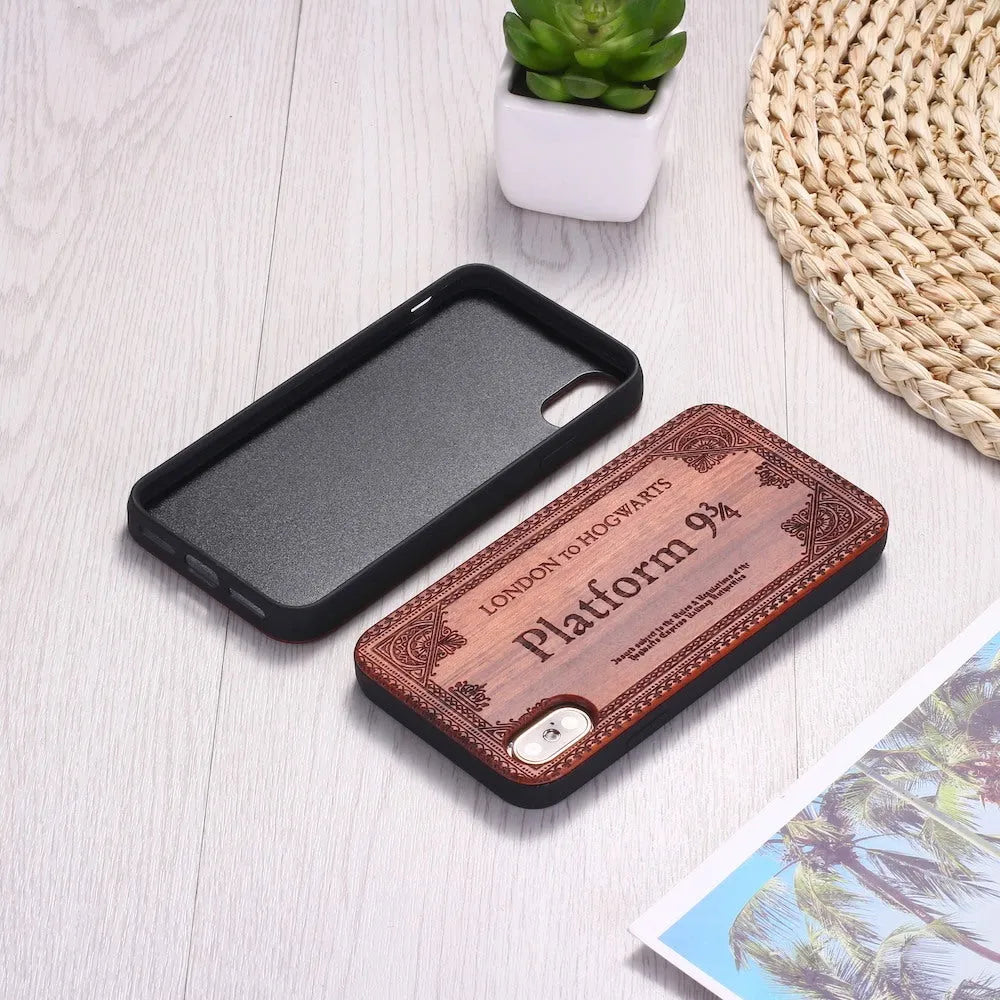 Wooden iPhone case with laser-carved floral design and black TPU bumper on a rosewood back.