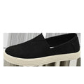Men's beige linen canvas slip-on shoes with a round toe and shallow cut on a plain background.