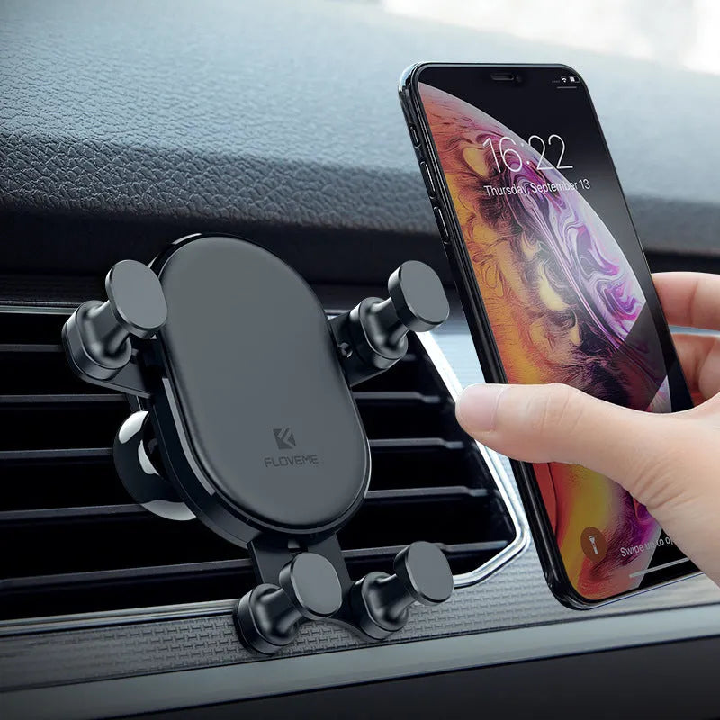Black gravity car phone holder with 360-degree rotation ball joint mounted on a car air vent.