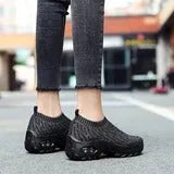 Women's air cushion walking shoes with breathable mesh upper, available in black, purple, grey, dark blue