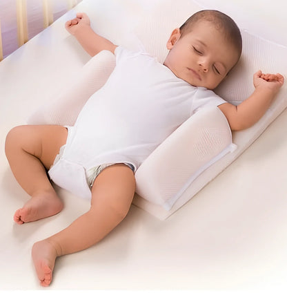 White baby sleep positioning pad with curved armrest and elevated head section