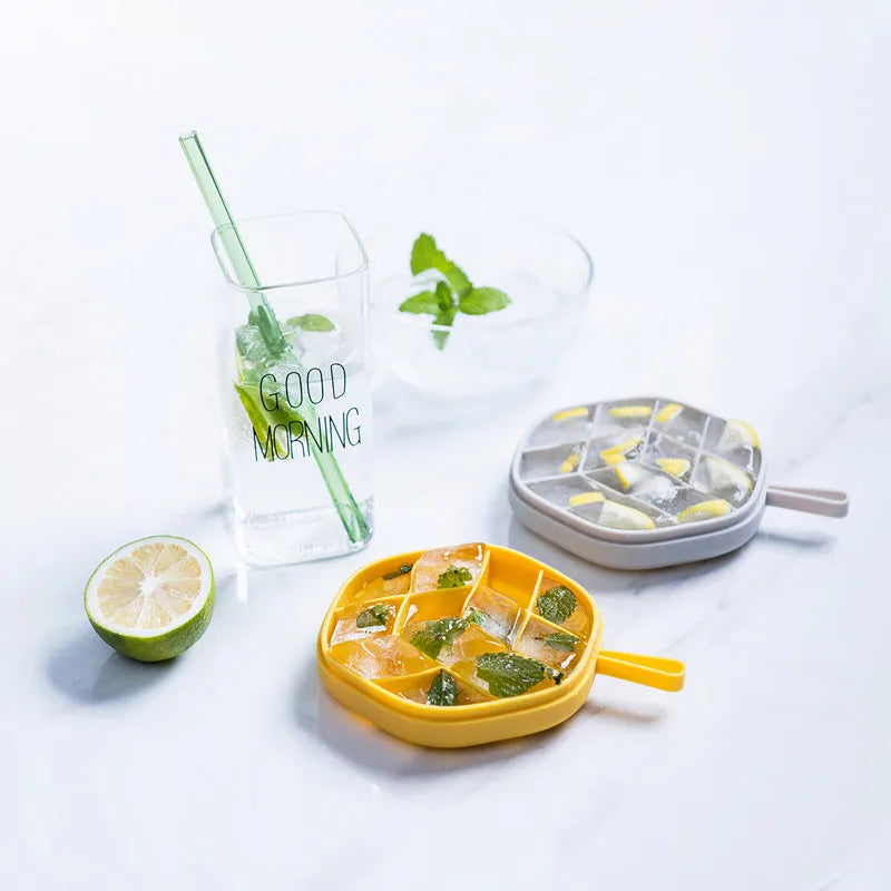 Blue silicone 12-cavity hexagon ice cube mould with silicone cover on white background