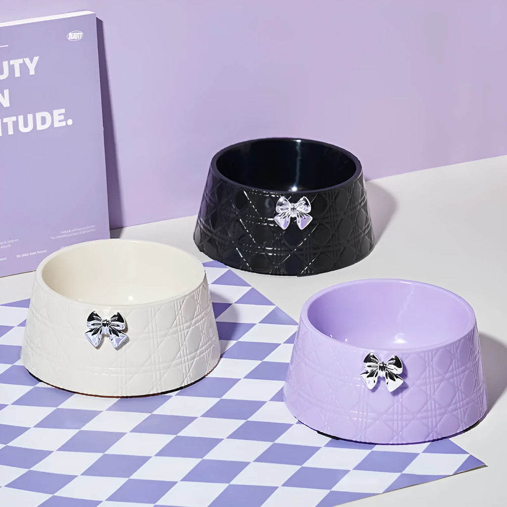 Ceramic pet bowl with bowknot and diamond pattern in pink, silver, black, purple, or white.