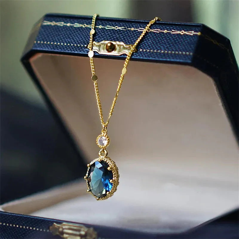 Gold geometric pendant necklace on a chain, French retro style.