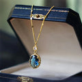 Gold geometric pendant necklace on a chain, French retro style.