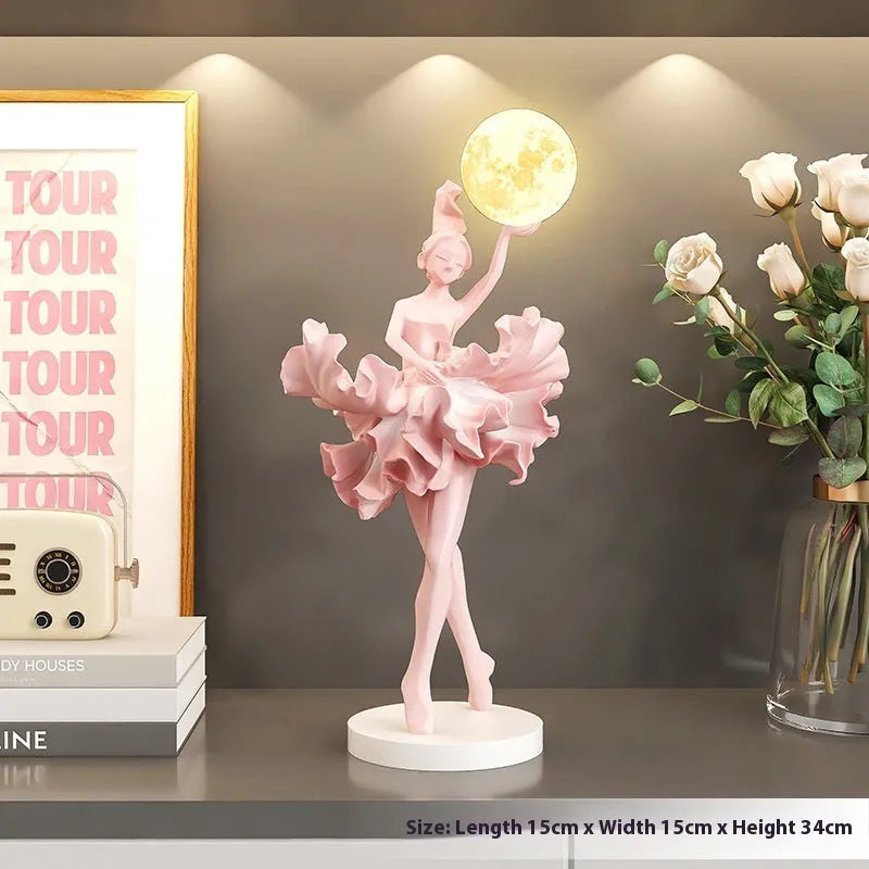 Resin ballet girl small night lamp in pink finish on tabletop