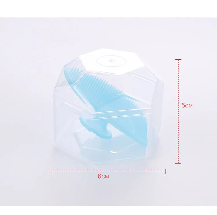 Silicone facial brush in three bristle zones with suction cup on blue background