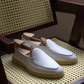 Men's handmade brown leather loafers with a low tube design and light TPR sole.
