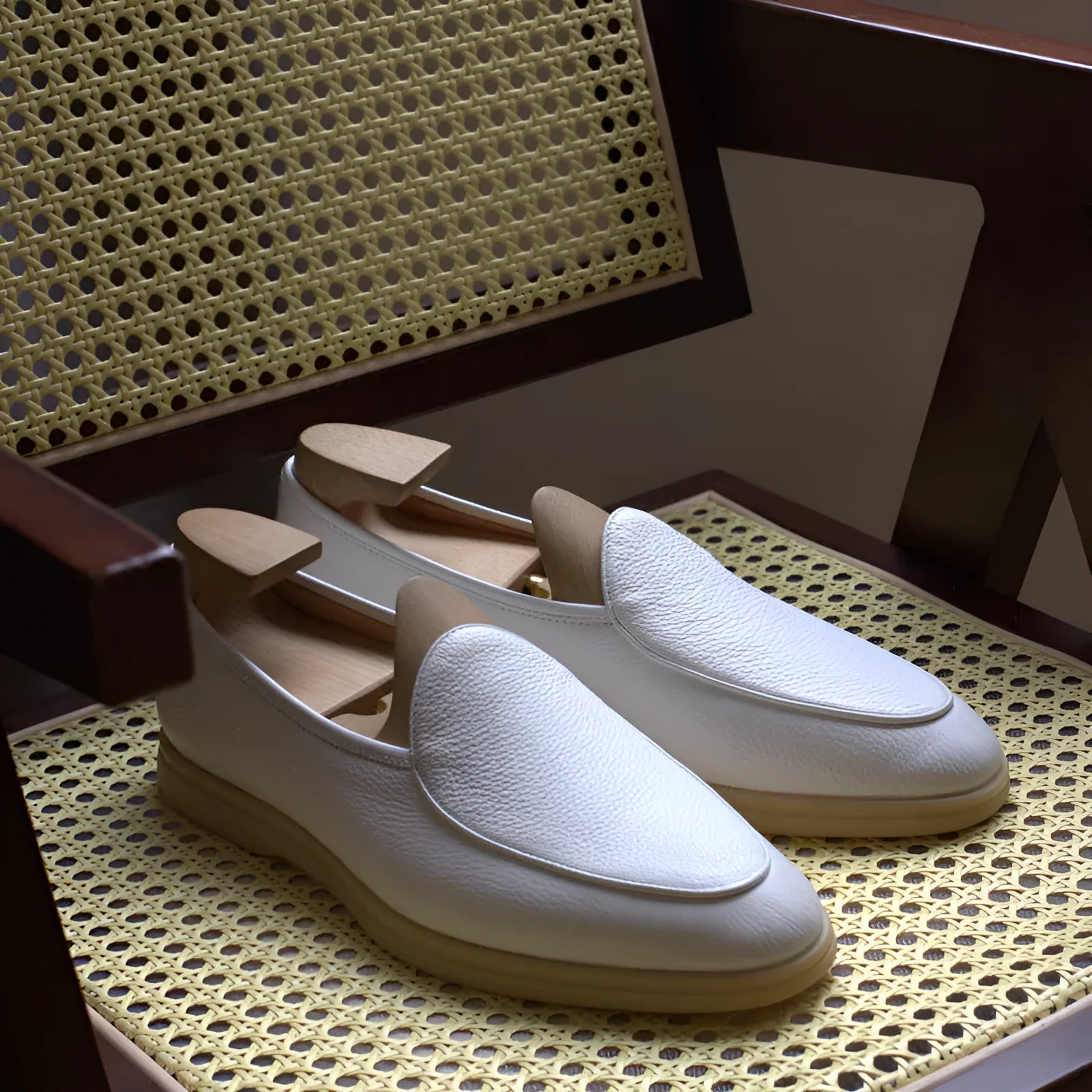 Men's handmade brown leather loafers with a low tube design and light TPR sole.