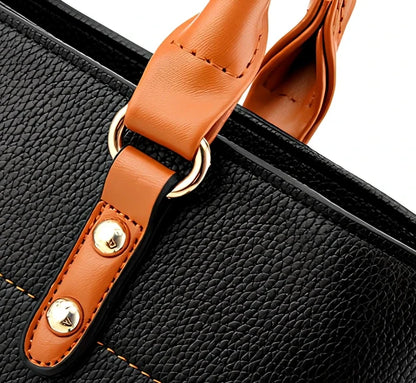 Women's black PU slung shoulder bag, 25cm height, adjustable strap for diagonal carry with phone and wallet inside