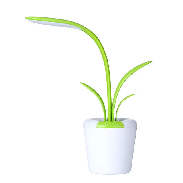 Modern rechargeable LED table lamp in pink with touch control and plant-shaped design on a wooden desk