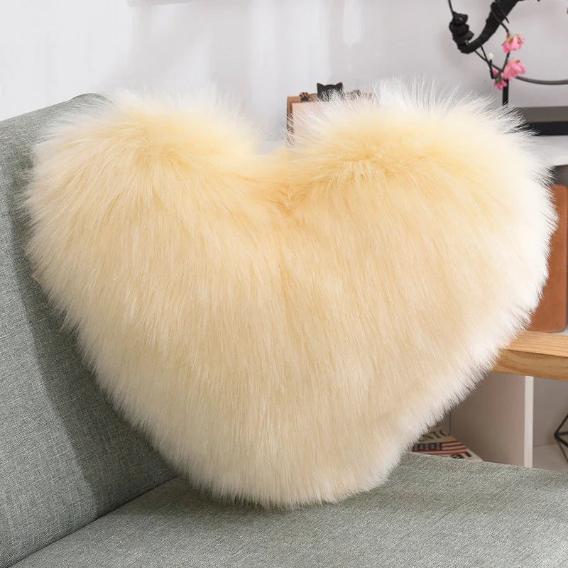 Plush heart-shaped throw pillows in various colors and styles for cozy sofa decor