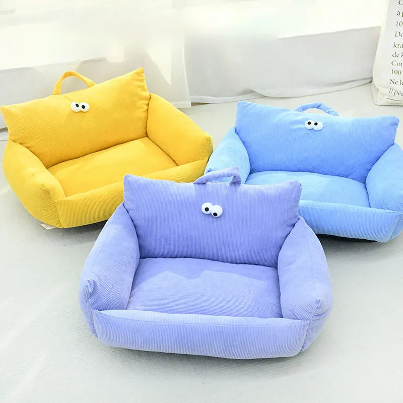 Cartoon Big Eye Nest pet bed in Moon velvet fabric for cats and small dogs, shown in blue.