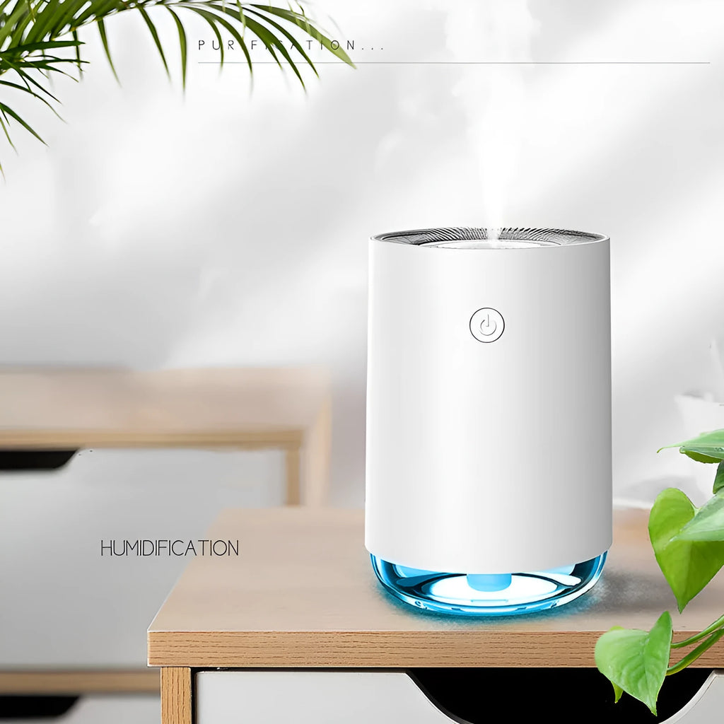 Green USB night light humidifier and essential oil diffuser with colour changing LED on a table