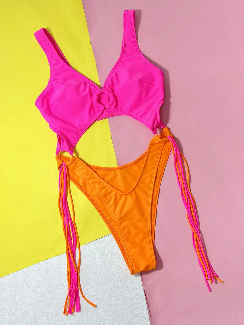 Women's rose red hollow-out steel ring tassel one-piece swimsuit on display