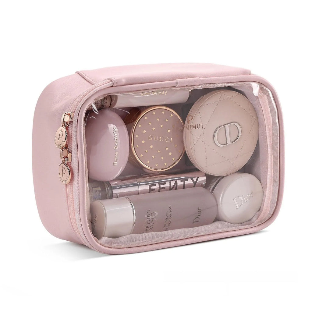 Clear PVC cosmetic bag with a zip open, showing a polyester lining and separate compartments.