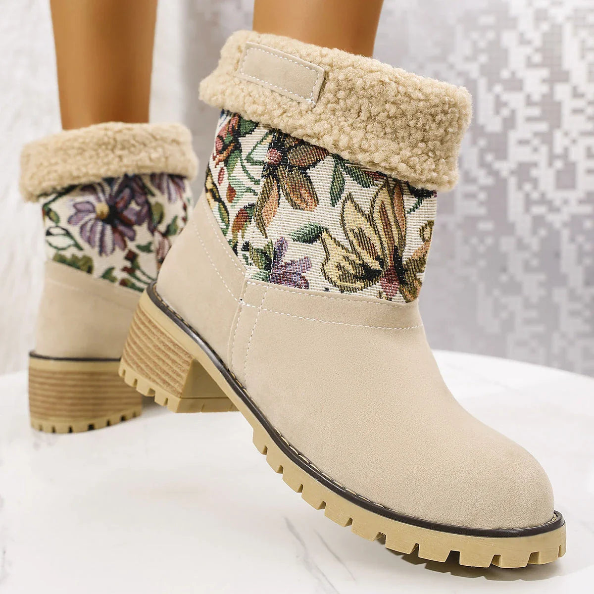 Stylish ethnic-inspired snow boots with floral embroidery, featuring a warm cotton interior and durable suede exterior in a variety of colors.