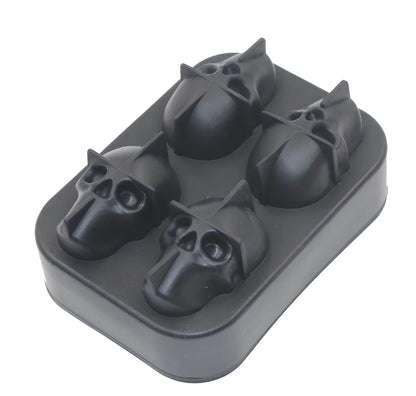 Black silicone ice cube tray with four skull-shaped cavities measuring 12cm long