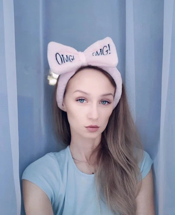 Coral velvet butterfly end hair band in pink with text styling, showing butterfly ends and cloth material