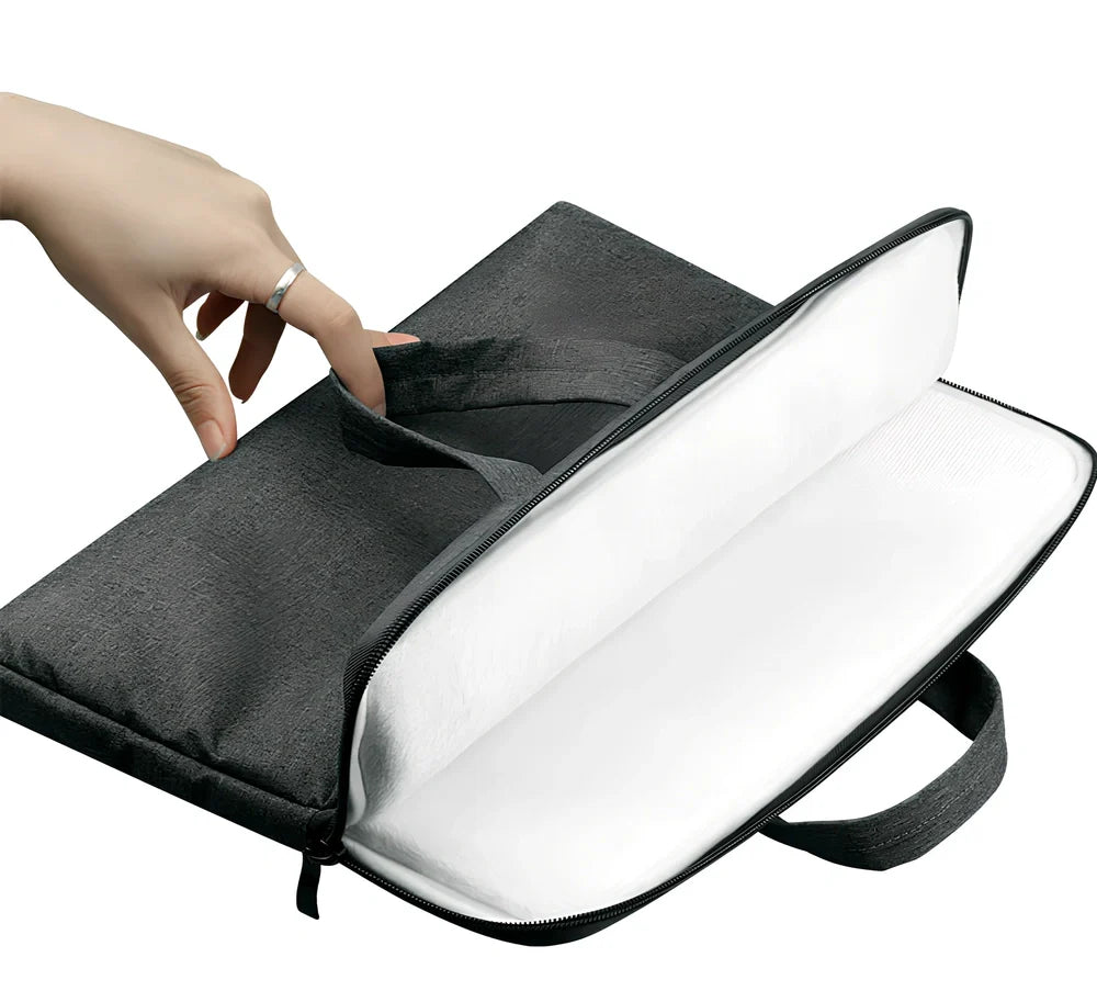Grey laptop sleeve for MacBook with ant cloth exterior and soft handle, showing internal plush lining