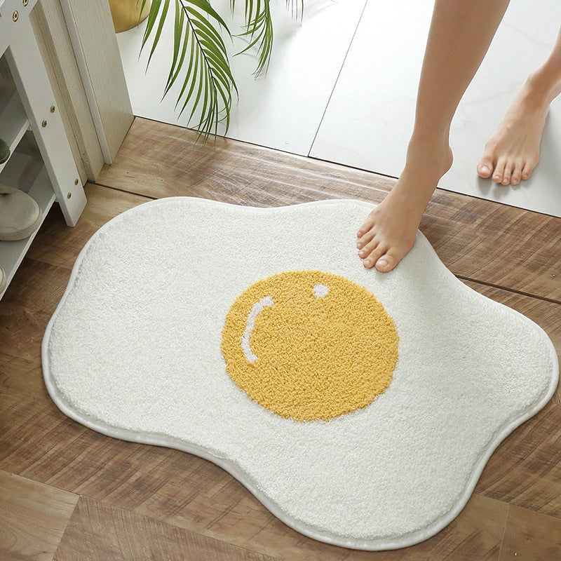 Stylish egg-shaped entrance mat made of premium polyester fabric with non-slip rubber backing, available in various sizes and colors to suit any Kiwi home's decor