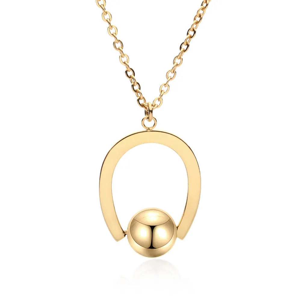 Stainless steel necklace with geometric pendant on a cross chain, shown in gold colour.