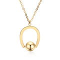 Stainless steel necklace with geometric pendant on a cross chain, shown in gold colour.