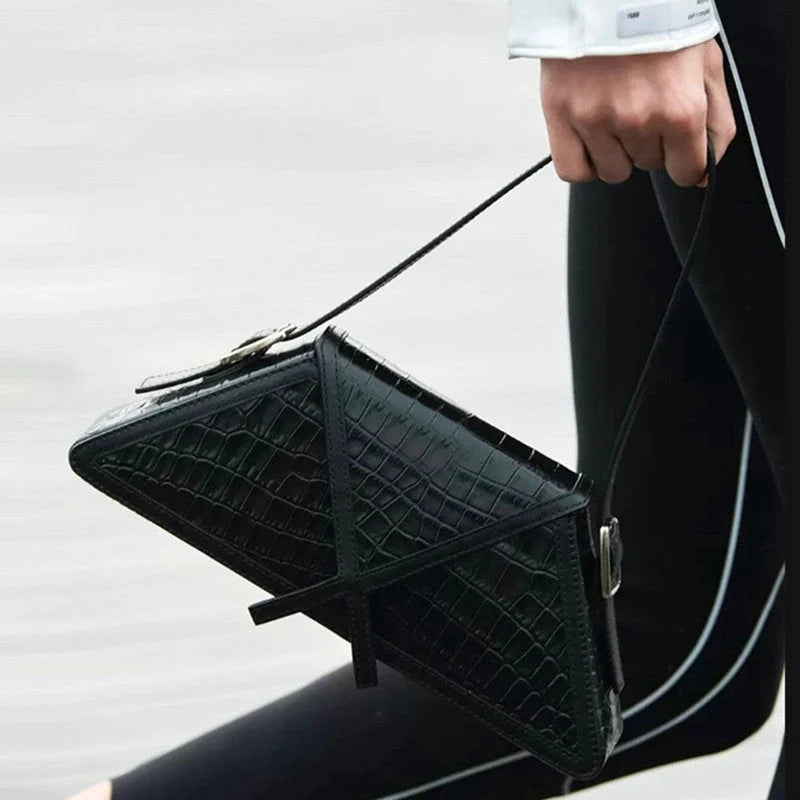 Stitching contrast trapezoid shoulder bag in black, beige, blue, and orange