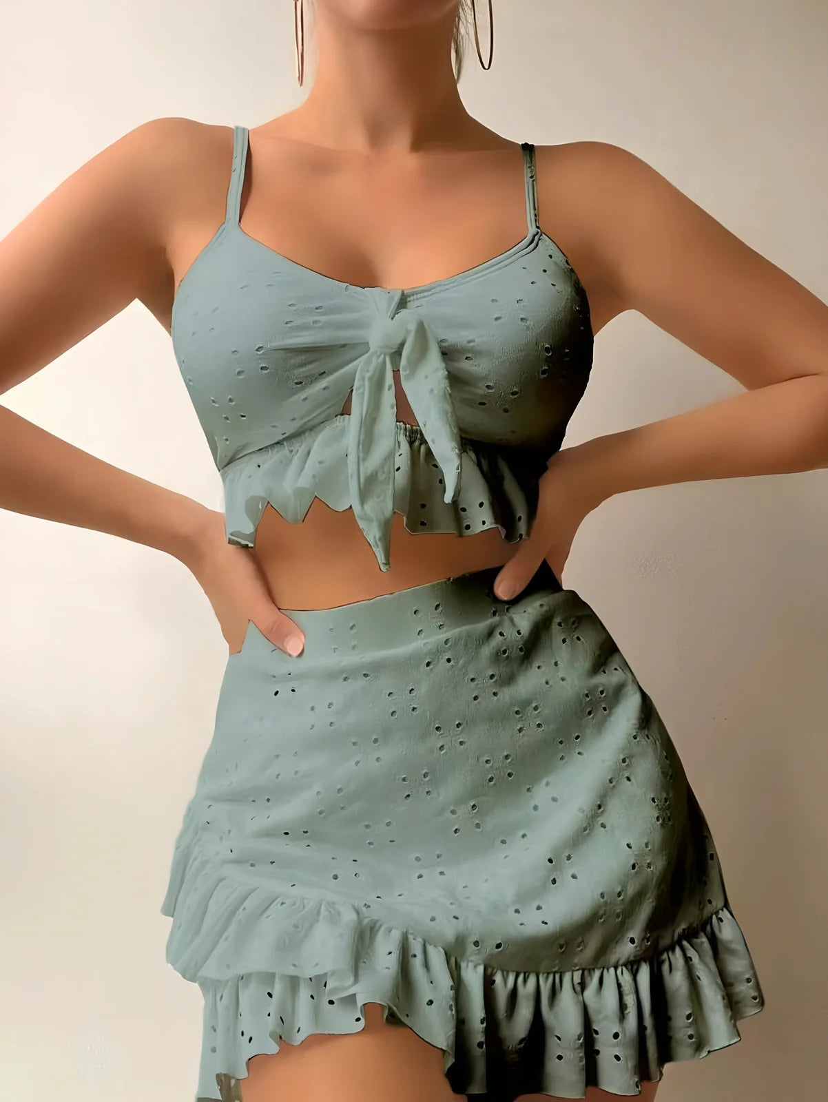 Women's 3-piece bikini set with hip-hugging skirt and ruffle detailing in polyester swimwear