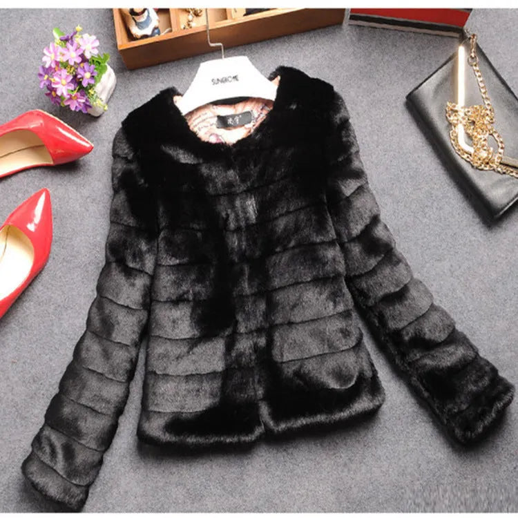 Women's short white faux fur top with regular sleeves, shown on a hanger.