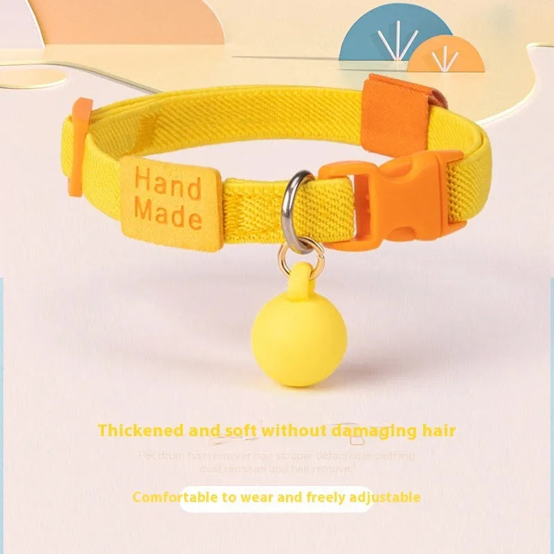 A stretchy, solid-colour polyester dog collar for small dogs, shown on an adjustable buckle.