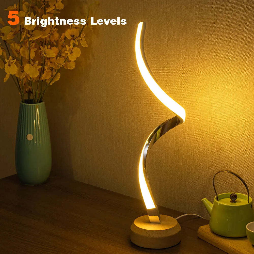 Modern wood LED spiral table lamp with touch dimmer and USB power on a bedside table