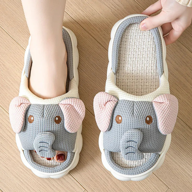 Elephant grey open-toe linen slippers for couples on a plain background.